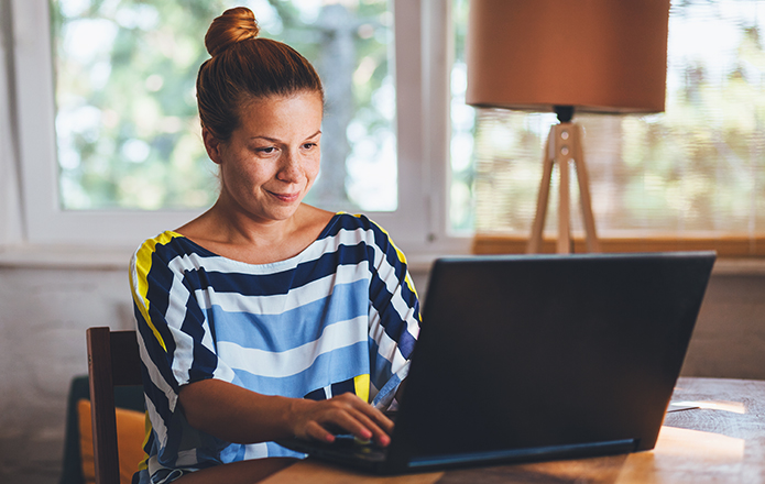 person using their laptop