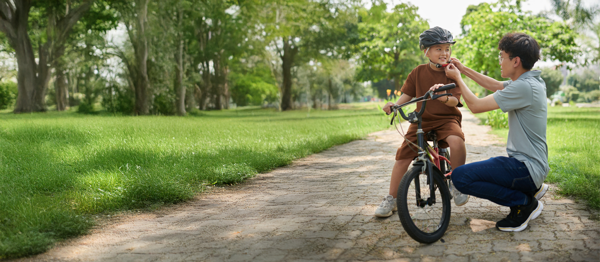 kid playing outside with bike